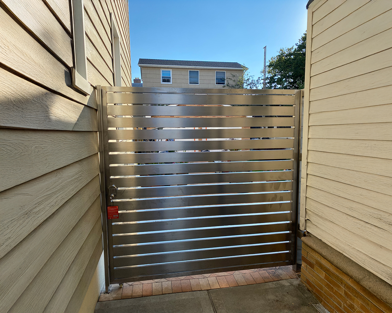 Custom Stainless Steel Driveway Gate & Matching Fence System (Arched Top, Decorative Infill)